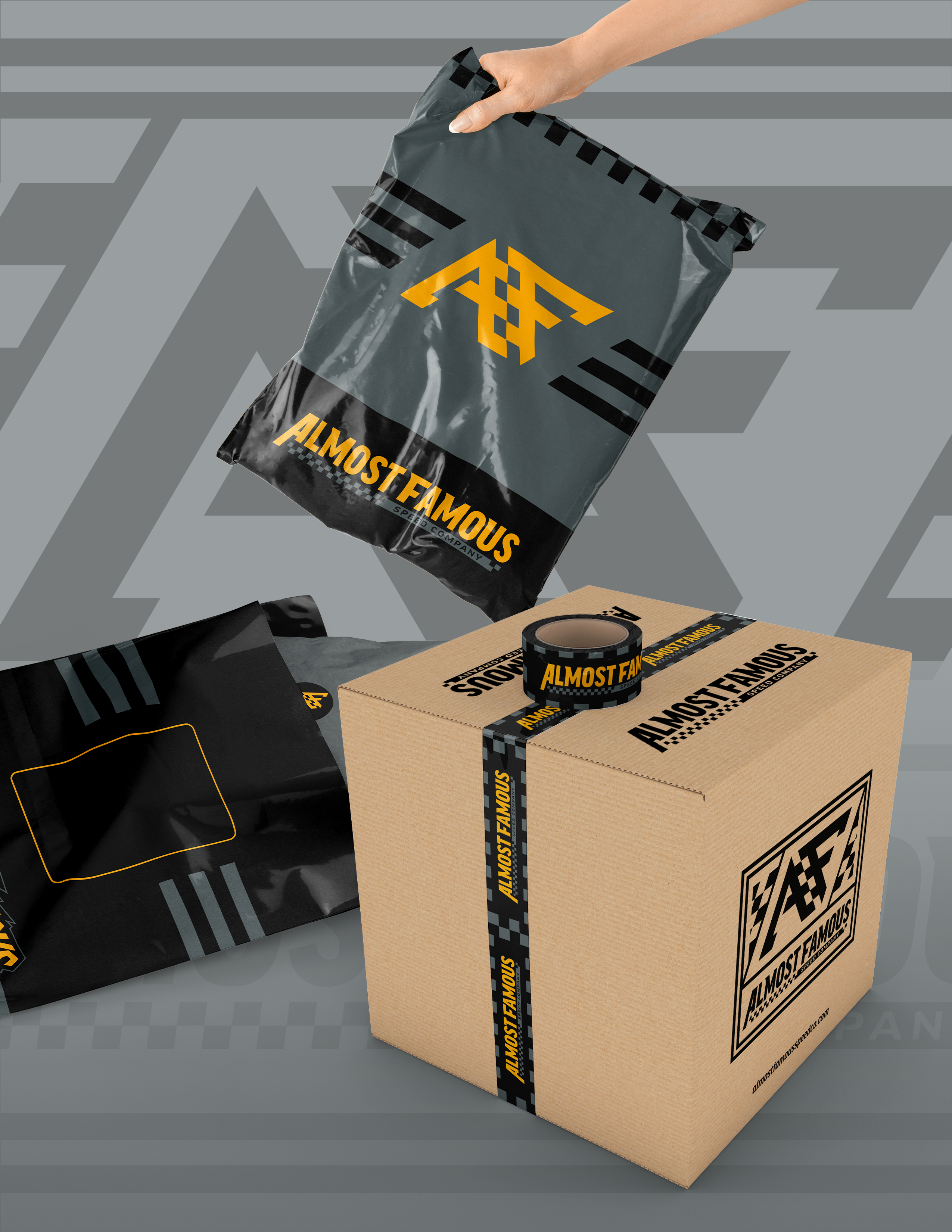 Almost Famous custom e-commerce packaging set featuring grey poly mailer bags with yellow AF logo, branded shipping tape, and cardboard box with printed logo, displayed on branded background