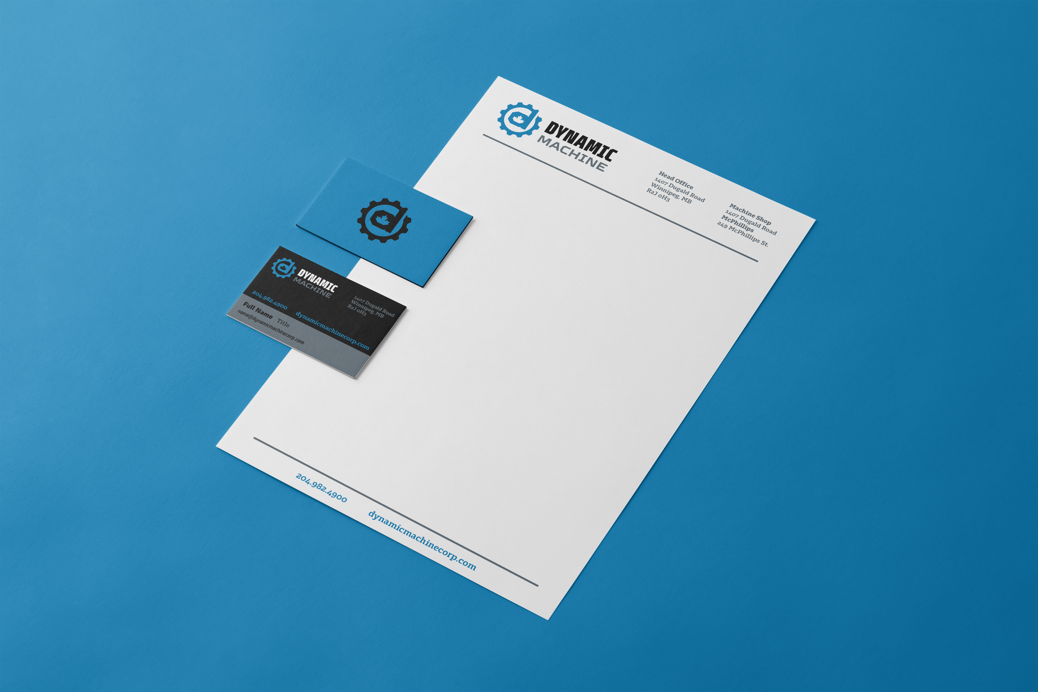 Dynamic Machine corporate stationery set with business cards and branded letterhead on a blue background, showcasing modern industrial logo and contact information