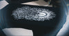 Black tee featuring intricate white graphic artwork of a sun and foliage.