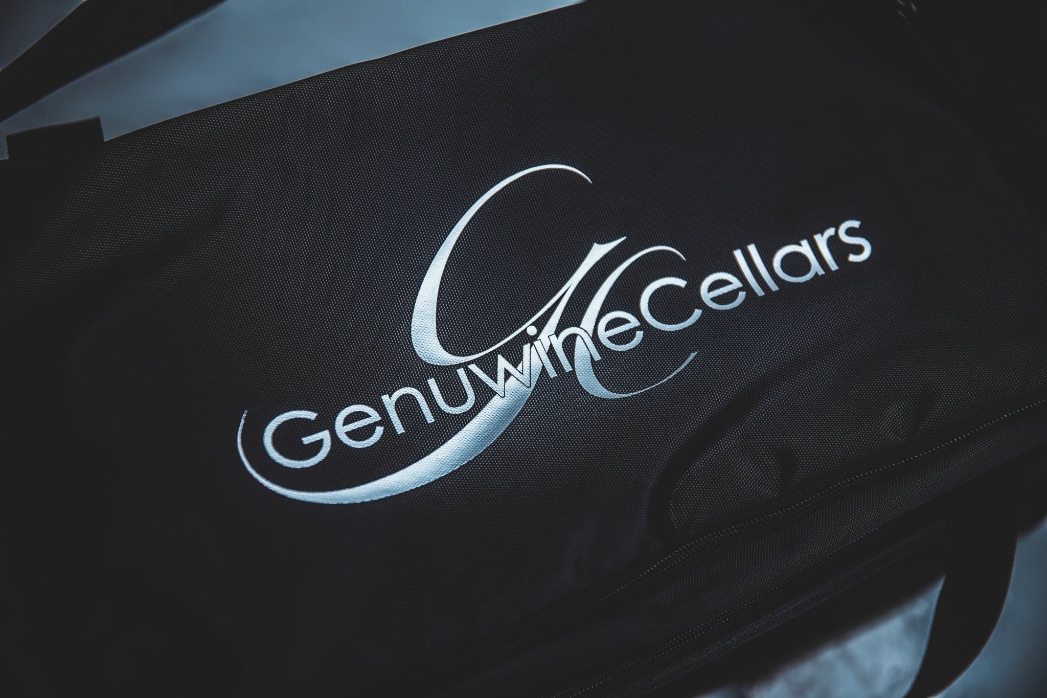 Black gym bag with custom heat transfer vinyl logo for Genuwine Cellars, produced in Winnipeg Manitoba Canada by Rogue Lab