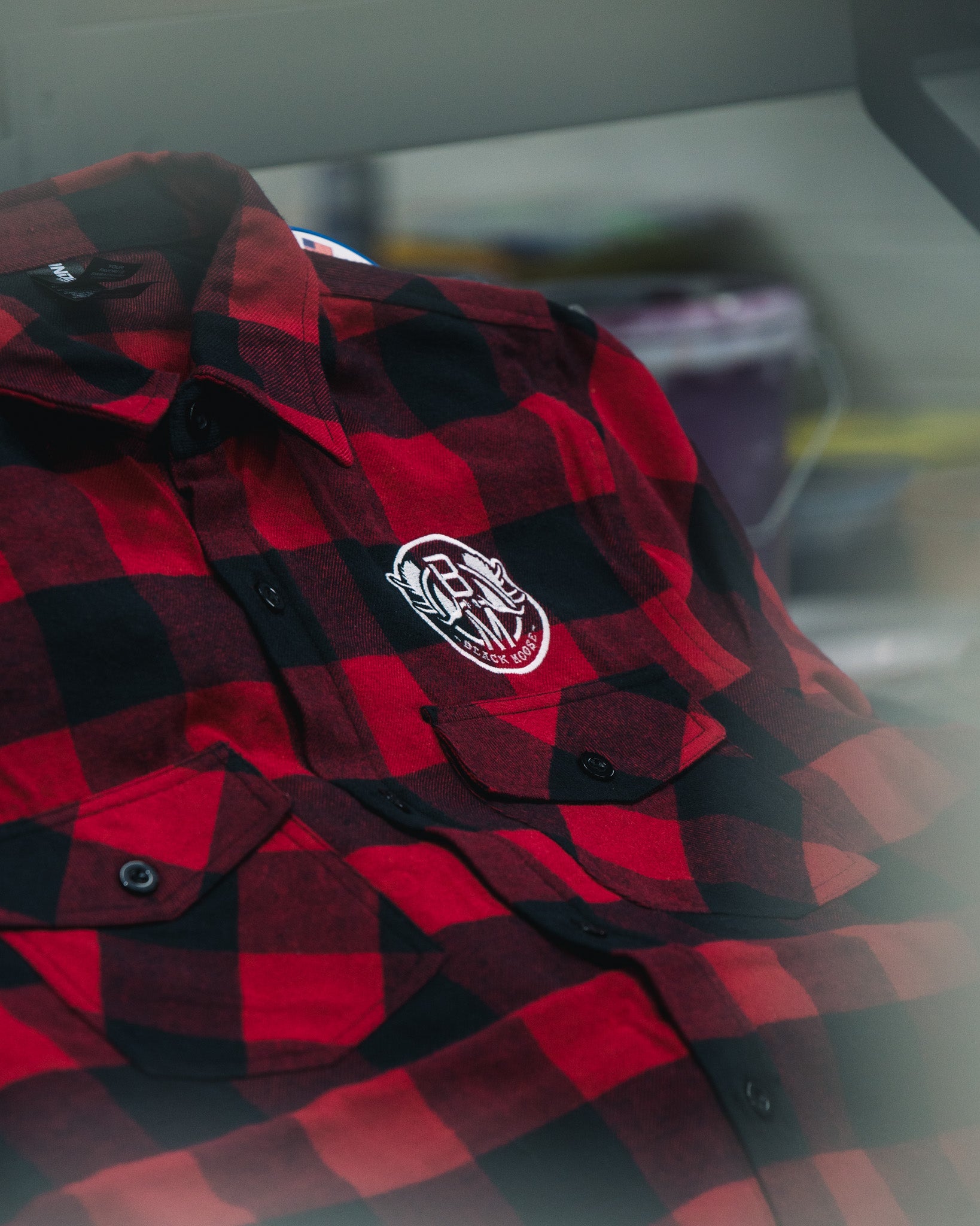shirt.jpg	Custom embroidered red and black flannel shirt with logo patch by Rogue Lab in Winnipeg, Manitoba