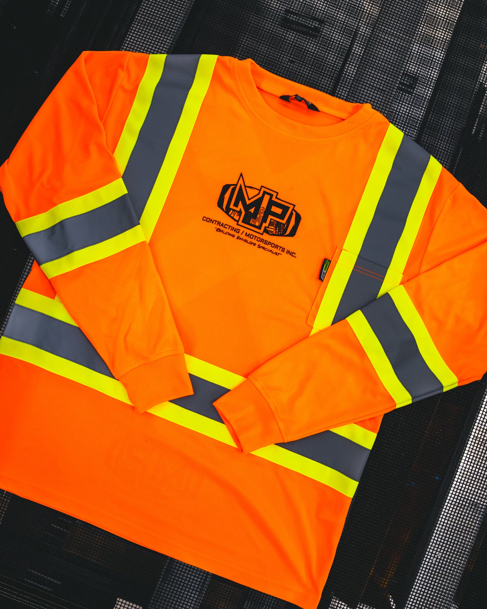 Custom embroidered high-visibility safety shirt with MP Contracting & Motorsports Inc. logo by Rogue Lab in Winnipeg, Manitoba